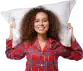 Woman in tartan pyjamas with pillow